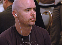 poker player john hennigan - with headphones on