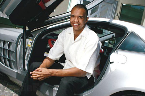 poker player phil ivey sitting in his fancy car