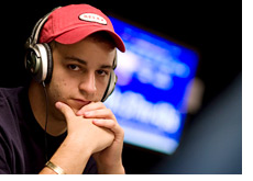 -- Sorel Mizzi wearing a red baseball cap and headphones --