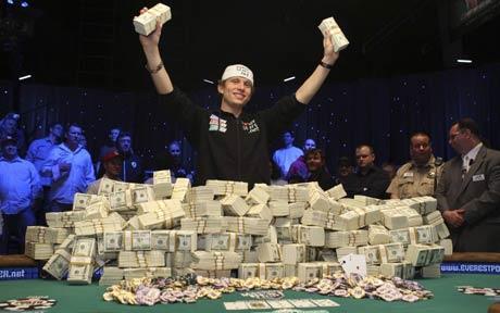 poker player peter eastgate wins the world series of poker 2008 - wsop - holds up stacks of cash
