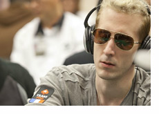 Bertrand ElkY Grospellier at the poker table wearing headphones