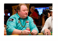 Greg Raymer with a gold chain and a WSOP gold bracelet