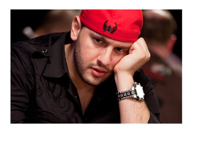 Archive photo of Michael TheGrinder Mizrachi wearing a red hat while playing poker