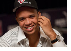 Phil Ivey with a big smile, striped shirt and a fancy watch