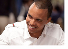 Phil Ivey wearing a white shirt and a big smile