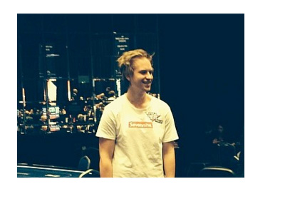 Viktor Blom with night city skyline in the background - Instagram photo