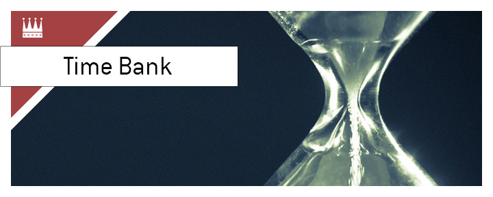 The meaning of time bank in the game of poker is explained. In photo: A sand clock. Hourglass on black background.