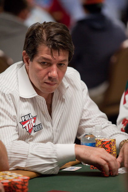 David Benyamine at the WSOP 2010 in a white striped shirt